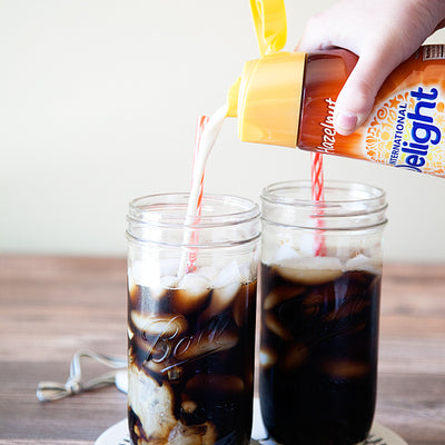 A tall glass of hazelnut iced Choffy over ice