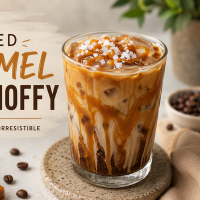 A glass of salted caramel iced Choffy with caramel drizzle and flaked salt