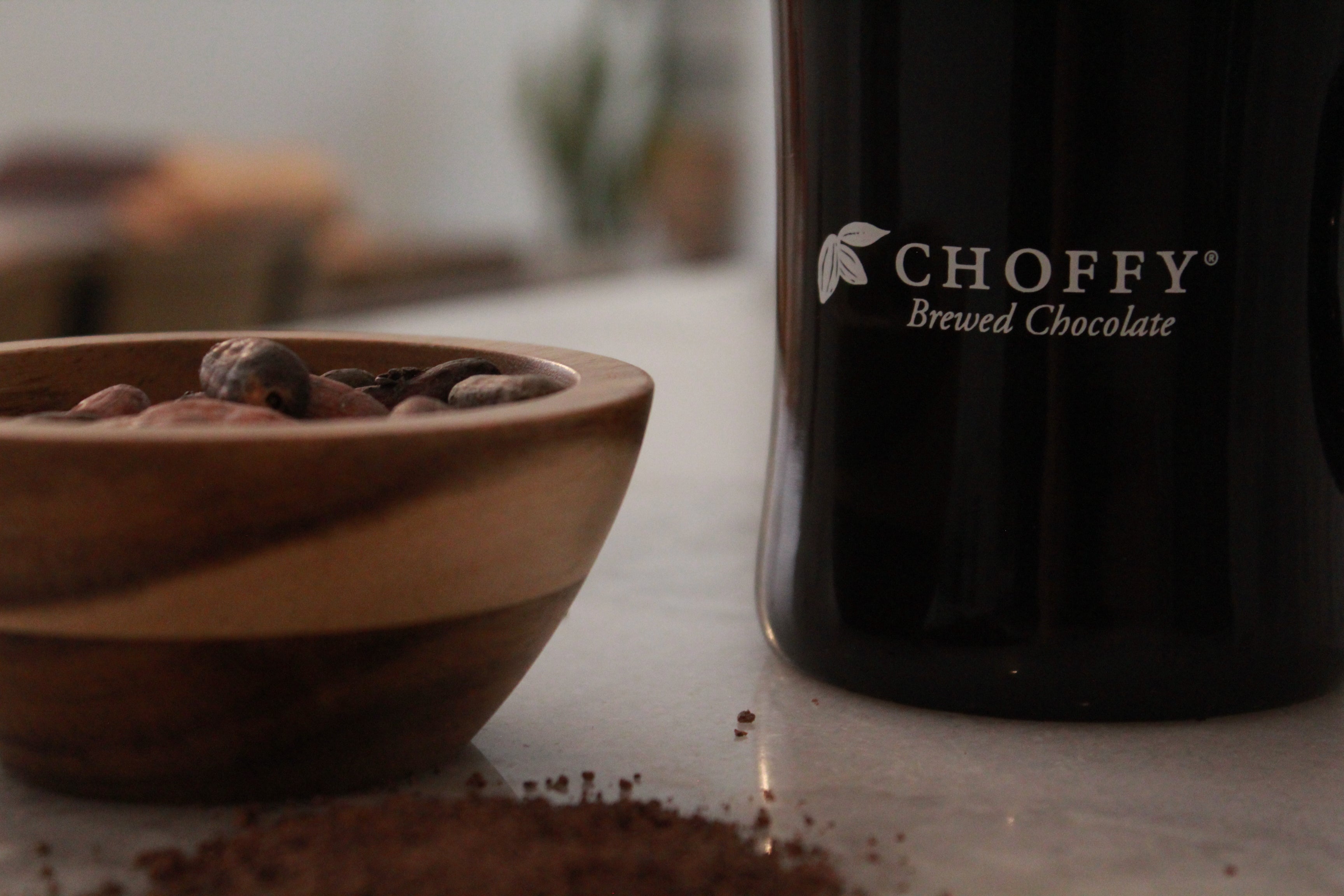 Choffy mug with cacao beans and grounds