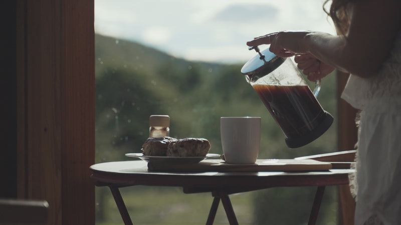 Woman pouring cup of Choffy